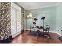 Well-lit room with an electric drum set. Hardwood floors and big windows at 2015 Towne Lake W Hls, Woodstock, GA 30189