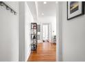 Bright hallway with hardwood floors, white walls, and stylish decor at 690 Piedmont Ne Ave # 17, Atlanta, GA 30308