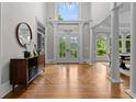 Grand foyer with high ceilings, hardwood floors, and an elegant doorway at 3905 Merriweather Woods, Johns Creek, GA 30022