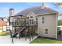 Multi-level deck with pergola, hot tub, and backyard access offers outdoor entertaining space at 150 Rose Creek Dr, Covington, GA 30014