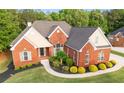 Beautiful two-story brick house with manicured landscaping and a welcoming front entrance at 150 Rose Creek Dr, Covington, GA 30014
