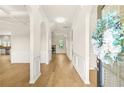 Bright foyer with hardwood floors, arched doorways, and detailed trim at 321 Shannon Ct, Mcdonough, GA 30252