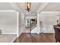 Open foyer with hardwood floors, detailed trim work, and view of the staircase at 3302 Avenel Ct, Snellville, GA 30078
