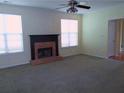 Cozy living room with a fireplace and large windows for natural light at 4677 Liberty Square Dr, Acworth, GA 30101