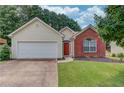 Charming single-Gathering home with a two-car garage and manicured front lawn at 965 Under Ct, Sugar Hill, GA 30518