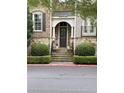Elegant front entrance featuring stone steps, decorative shrubs, and classic architectural details at 2313 Saint Davids Nw Sq # 12, Kennesaw, GA 30152