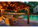 Inviting outdoor living space with a comfortable seating area and a view of the pool at 2882 Clary Hill Ne Dr, Roswell, GA 30075
