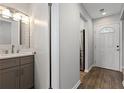 Bright bathroom featuring a modern vanity, decorative mirror, and stylish fixtures at 4406 Idlewood Ln, Tucker, GA 30084