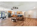 Spacious open-concept living area with hardwood floors and natural light at 4825 Rollins Dr, Powder Springs, GA 30127