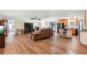 Open-concept living space with wood floors, perfect for entertaining and relaxing at 4825 Rollins Dr, Powder Springs, GA 30127