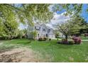 Charming two-story home with a well-manicured lawn, beautiful landscaping, and an attached two-car garage at 870 Underhill Ct, Sugar Hill, GA 30518