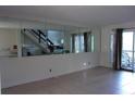Living room featuring tile floors, large mirror, and a sliding glass door leading to an outdoor space at 2814 Shellbark Rd, Decatur, GA 30035
