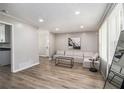 Bright living room features sleek floors, a modern couch, and ample natural light from a large window at 479 Charter Oak Sw Dr, Atlanta, GA 30331