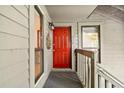 Apartment with bright red front door, gray railing, and covered entryway at 1424 Tuxworth Cir, Decatur, GA 30033