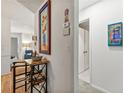 Hallway featuring decorative paintings, a table with a wine rack, and access to other rooms at 1424 Tuxworth Cir, Decatur, GA 30033