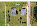 Aerial view showcasing a .31 acre lot with two existing structures and ample green space at 21 Elm St, Hampton, GA 30228