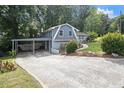 Exterior view showing a carport and long driveway at 2950 Springfield Sw Ct, College Park, GA 30349