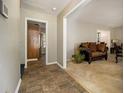Inviting foyer with tile flooring leading to the living room with comfortable seating at 2950 Springfield Sw Ct, College Park, GA 30349