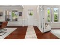 Elegant entryway with hardwood floors, white trim, and large windows for ample natural light at 337 Spotted Ridge Cir, Woodstock, GA 30188