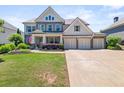 Charming two-story home with a manicured lawn, a three-car garage, and classic American design at 337 Spotted Ridge Cir, Woodstock, GA 30188