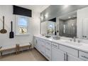 Spacious bathroom boasts dual sinks, a large mirror, and contemporary fixtures at 1107 Rivard Nw Cir, Atlanta, GA 30318