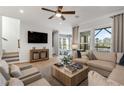 Bright living room features hardwood floors, a comfortable sofa, and a large window at 1107 Rivard Nw Cir, Atlanta, GA 30318