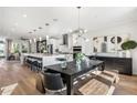 Bright, open kitchen featuring a large island, stainless steel appliances, and modern pendant lighting at 1109 Rivard Nw Cir, Atlanta, GA 30318