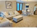 Cozy living room featuring neutral tones, comfortable seating, and ample natural light at 2167 Del Lago Cir # 11, Kennesaw, GA 30152