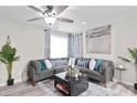 Cozy living room with a gray sectional, stylish decor, and an airy atmosphere at 246 Aurora Nw Ave, Atlanta, GA 30314
