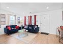 Cozy living room with bright windows, dark sofas, and modern decor at 251 Aurora Nw Ave, Atlanta, GA 30314