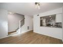 Bright, modern living room and open staircase, flowing into kitchen area at 510 Northridge Crossing Dr, Sandy Springs, GA 30350