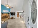 Inviting living room featuring tile floors, a stone fireplace, and lots of natural light at 2956 Springlake Dr, Buford, GA 30519