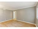 Spacious living room featuring wood floors, neutral paint, and natural light at 91 Rumson Ne Rd # B25, Atlanta, GA 30305