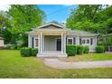 Inviting home with a quaint covered porch and well-maintained front yard at 3288 Dogwood St, Atlanta, GA 30337