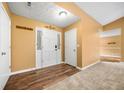 Inviting entryway with hardwood floors, a modern front door, and neutral paint at 5535 Dorsett Shoals Rd, Douglasville, GA 30135
