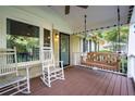Cozy front porch with rocking chairs and swing, perfect for relaxing outdoors at 118 Lucia Dr, Smyrna, GA 30082