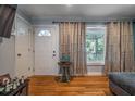 Inviting living room showcasing a front door and hardwood flooring at 118 Lucia Dr, Smyrna, GA 30082