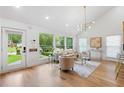 Bright living room featuring hardwood floors, lots of windows, vaulted ceiling, and stylish furnishings at 2001 Swazey Dr, Decatur, GA 30032