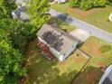 Aerial view of a house featuring a large backyard with a deck at 1620 Cedar Hl, Douglasville, GA 30134