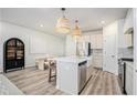 Contemporary kitchen with stainless steel appliances, a center island, and a dining area nearby at 1704 Hyssop Se Blvd, Smyrna, GA 30126