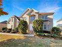 Attractive two-story home with manicured lawn and mature trees creating pleasing curb appeal at 2577 Ozella Sw Pl, Atlanta, GA 30331