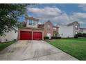 Charming brick home with a two-car garage and well-maintained lawn against a backdrop of fluffy clouds at 1801 Deer Crossing Cir, Jonesboro, GA 30236