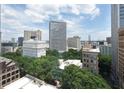This cityscape features various architectural styles, showcasing green trees and a mix of modern and classic buildings at 57 Forsyth Nw St # 11G, Atlanta, GA 30303