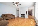 Bright living room with hardwood floors, a fireplace, and large windows at 3641 Mountain Cove Rd, Snellville, GA 30039
