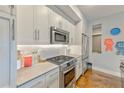 Modern kitchen with stainless steel appliances, subway tile backsplash, and quartz countertops at 1100 Howell Mill Nw Rd # 312, Atlanta, GA 30318