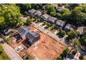 New gray homes surrounded by trees in a residential neighborhood, highlighted by nearby urban streets at 272 1St Ave, Avondale Estates, GA 30002