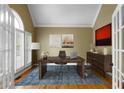 Bright home office with hardwood floors, vaulted ceilings, and a stylish desk with decor at 1377 Downington Nw Ln, Acworth, GA 30101