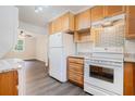 Bright kitchen with wooden cabinets, granite countertops, and modern appliances at 2714 Laurel Ridge Dr, Decatur, GA 30033