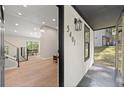 Open entryway leads to a living area with wood floors and abundant natural light at 5401 Martins Crossing Rd, Stone Mountain, GA 30088