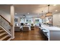 Open-concept living space boasting hardwood floors, modern decor, and a seamless flow throughout at 306 Rockledge Sw Bnd, Powder Springs, GA 30127